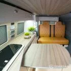 VW T6.1 LWB campervan kitchen interior with winter flooring, latte units and driftwood accents