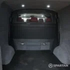 Spacious rear boot space inside the VW T6 Highline campervan, ideal for carrying camping gear and essentials.