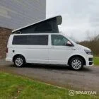 Driver side view of VW T6 with poptop up.