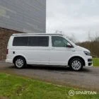 Driver side view of VW T6 with poptop down.