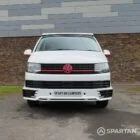 Straight front view of VW T6 with poptop down.
