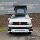 Straight front view of VW T6 with poptop up.