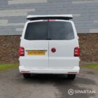 Straight rear view of VW T6 with poptop up.