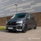 VW T6.1 Kombi with poptop roof down, maintaining a sleek silhouette