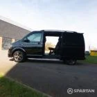 Open side door view of the VW T6 Highline SWB campervan, showcasing easy access to the modern interior.