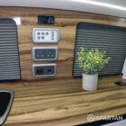 Copper Bronze VW T6.1 LWB campervan showing the Interior - Wireless Charger & Control Panel