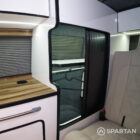 Copper Bronze VW T6.1 LWB campervan showing the Interior - Wardrobe