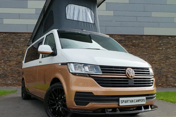VW T6.1 Candy White & Copper Bronze campervan front driver quarter view poptop up