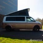 Copper Bronze VW T6.1 LWB campervan showing the driver side on poptop up