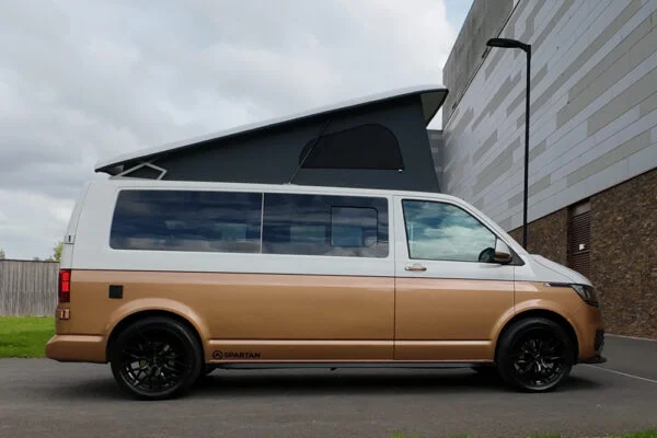Copper Bronze VW T6.1 LWB campervan showing the driver side on poptop up
