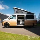 Copper Bronze VW T6.1 LWB campervan showing the passenger side on poptop up