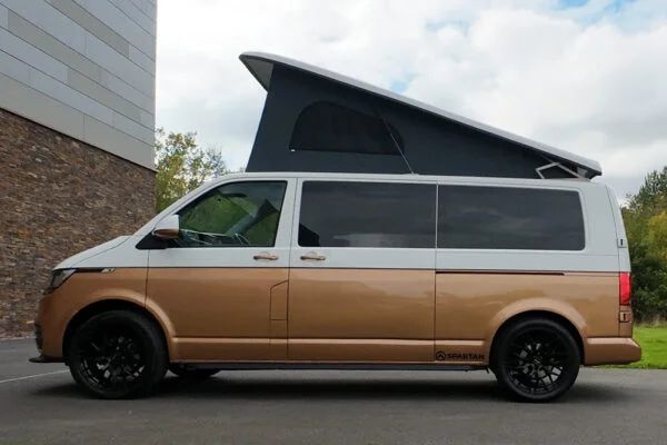 Copper Bronze VW T6.1 LWB campervan showing the passenger side on poptop up