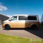 Copper Bronze VW T6.1 LWB campervan showing the passenger side on poptop down