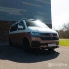 Copper Bronze VW T6.1 LWB campervan showing the front driver quarter poptop down