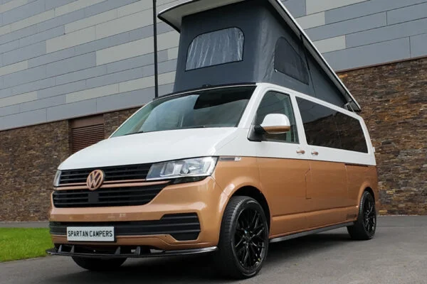 Copper Bronze VW T6.1 LWB campervan showing the front/passenger quarter poptop up