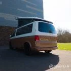 Copper Bronze VW T6.1 LWB campervan showing the rear/passenger quarter poptop up