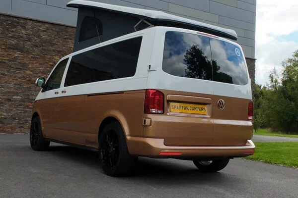 Copper Bronze VW T6.1 LWB campervan showing the rear/passenger quarter poptop up