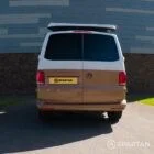 Copper Bronze VW T6.1 LWB campervan showing the rear straight on poptop up