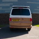 Copper Bronze VW T6.1 LWB campervan showing the rear straight on poptop up