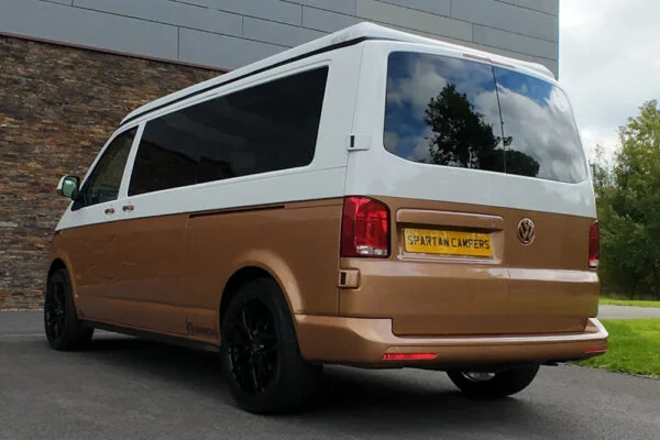 Copper Bronze VW T6.1 LWB campervan showing the rear/passenger quarter poptop down
