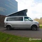 Squirrel Grey VW T6 SWB campervan showing the driver side on poptop up