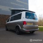 Squirrel Grey VW T6 SWB campervan showing the rear/passenger quarter poptop up