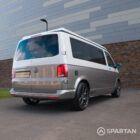 Squirrel Grey VW T6 SWB campervan showing the rear driver quarter poptop down
