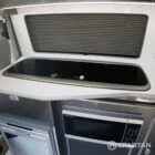 Compact sink and hob built into the Carbon-effect kitchen counter