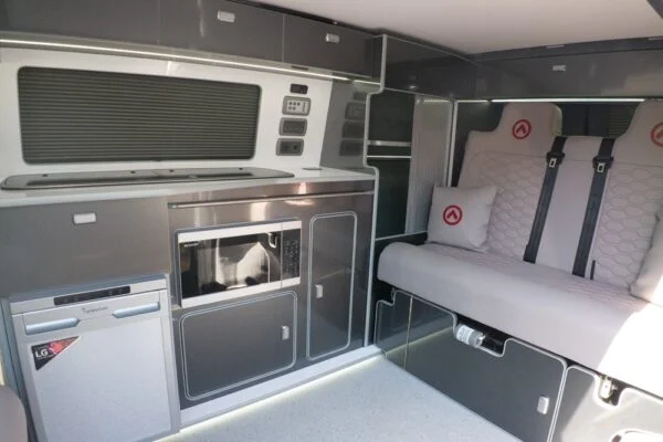 Campervan kitchen featuring Blizzard cabinetry and Carbon worktop