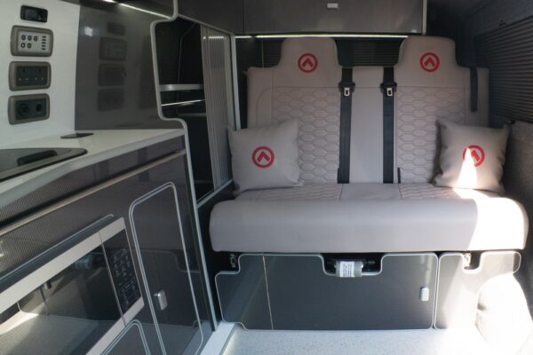 Fold-out rock and roll bed upholstered in Dusk Grey fabric