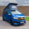 Front driver quarter view of VW T6.1 LWB with poptop down – the ultimate money shot