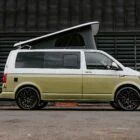 Driver side view of VW T6 Spartan Campervan with poptop up