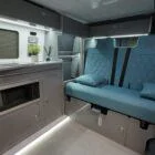 Spartan Campers VW T6 campervan rock and roll bed setup, fully extended to show spacious sleeping area with high-quality fabric and stitching