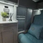 Slimline wardrobe inside a Spartan VW T6 SWB campervan, providing smart vertical storage with soft-close doors and integrated lighting