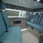 Front bench seat inside a Spartan VW T6 SWB campervan, ideal for passengers and finished in stylish, durable upholstery
