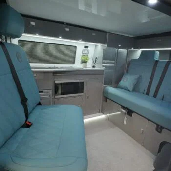 Front bench seat inside a Spartan VW T6 SWB campervan, ideal for passengers and finished in stylish, durable upholstery