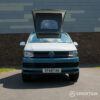 Spartan Campers VW Transporter T6 SWB campervan with raised poptop, front view showing its signature two-tone design