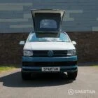 Spartan Campers VW Transporter T6 SWB campervan with raised poptop, front view showing its signature two-tone design