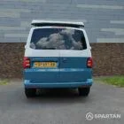 Straight rear view of Spartan Campers VW T6 campervan with raised poptop, perfect for added headroom and rear access