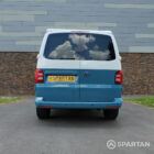 Rear view of Spartan Campers VW Transporter T6 SWB campervan with poptop roof down, finished in two-tone Neptune blue and candy white