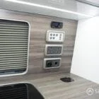 Integrated Spartan control panel with wireless charging dock for modern camper living