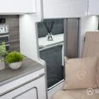 Sleek Spartan-built silver birch wardrobe offering seamless storage inside the campervan