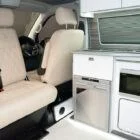 Built-in microwave integrated into Spartan's handcrafted white and birch cabinetry