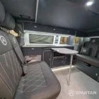 Wide interior view of VW T6.1 LWB campervan with blizzard floor, grey and white units and pewter upholstery