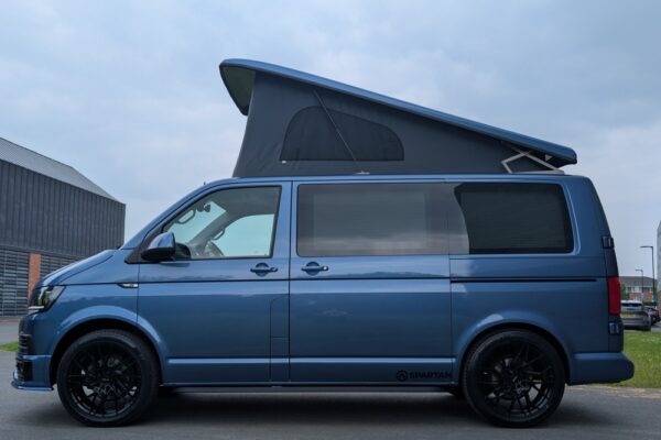 Spartan Campers VW T6 SWB campervan conversion in Acapulco Blue with pop-top roof raised, passenger side view