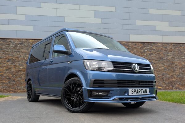 Spartan Campers VW T6 SWB campervan conversion in Acapulco Blue with pop-top roof closed, front driver quarter view