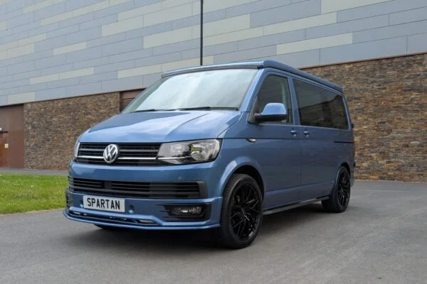 Spartan Campers VW T6 SWB campervan conversion in Acapulco Blue with pop-top roof closed, front passenger quarter view
