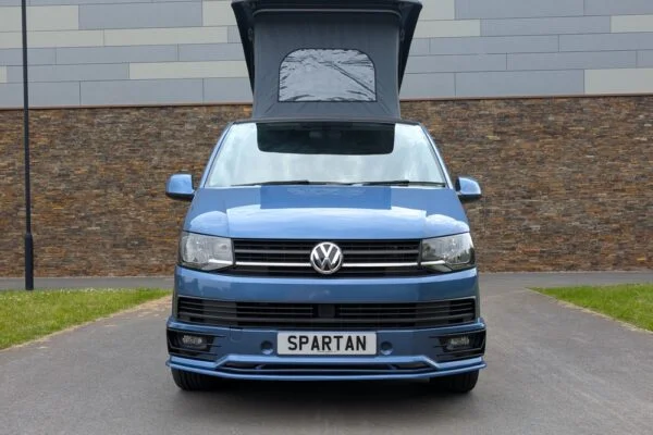 Spartan Campers VW T6 SWB campervan conversion in Acapulco Blue with pop-top roof raised, front view