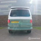 Rear straight-on image of Spartan campervan in sage green with roof open