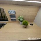 Wireless charger and digital control panel in VW T6.1 LWB campervan interior